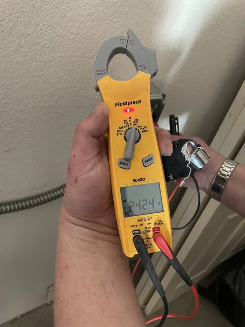 Voltage testing with clamp meter during Generator Installation in Evergreen